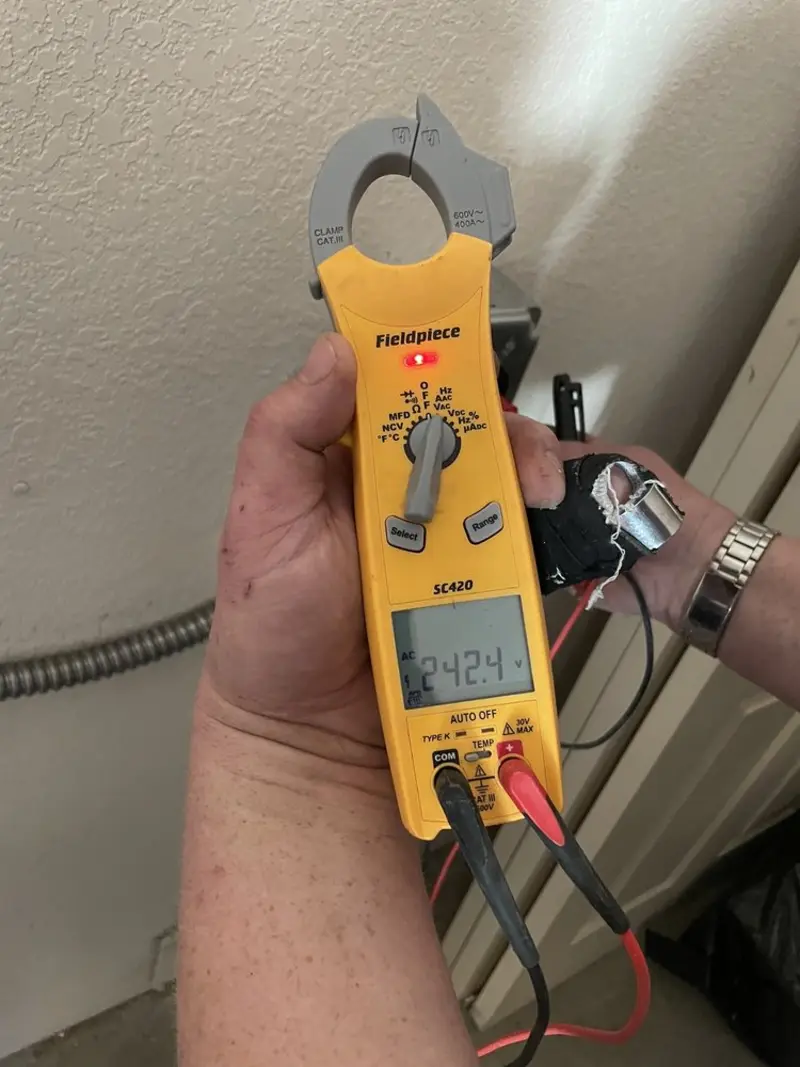 Voltage testing with clamp meter during Generator Installation in Moapa Valley